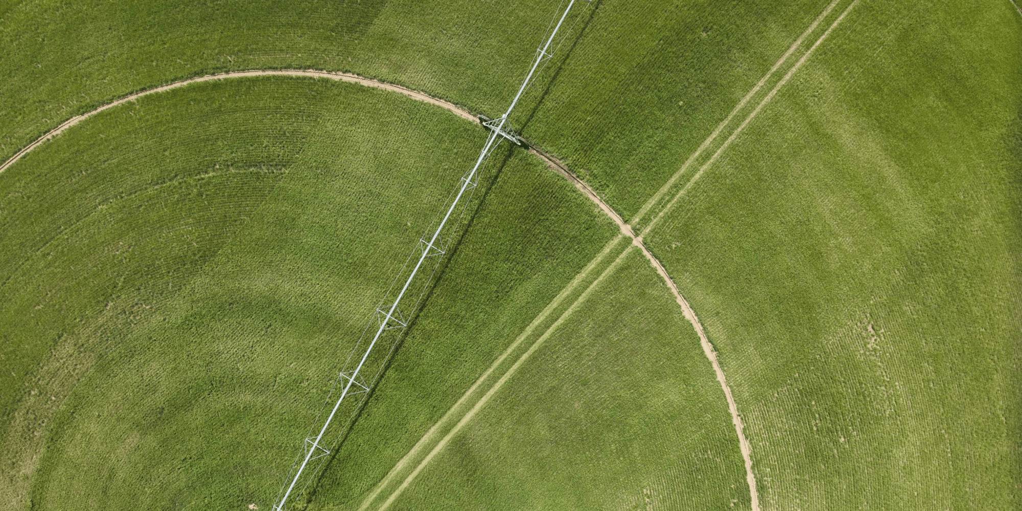 An aerial view of a circular irrigation system in a green field