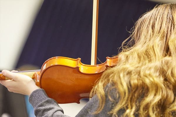 MHC Conservatory - close up of teen playing the violin