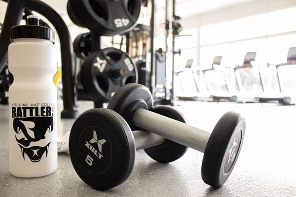 Close up of weights and a Rattlers water bottle in the Fitness Centre