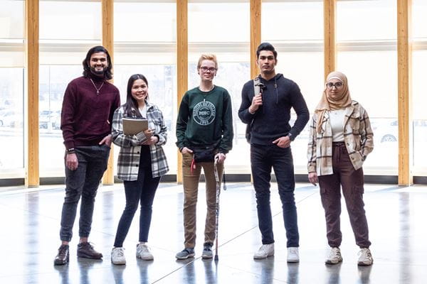 Five students standing in Big Eagle Indigenous Gathering Space