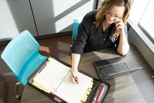 Extended Learning student studying at table. 