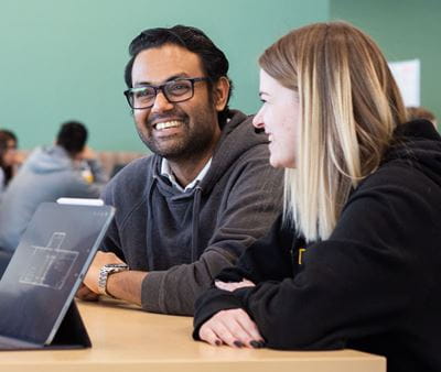 Students working at a table in the library