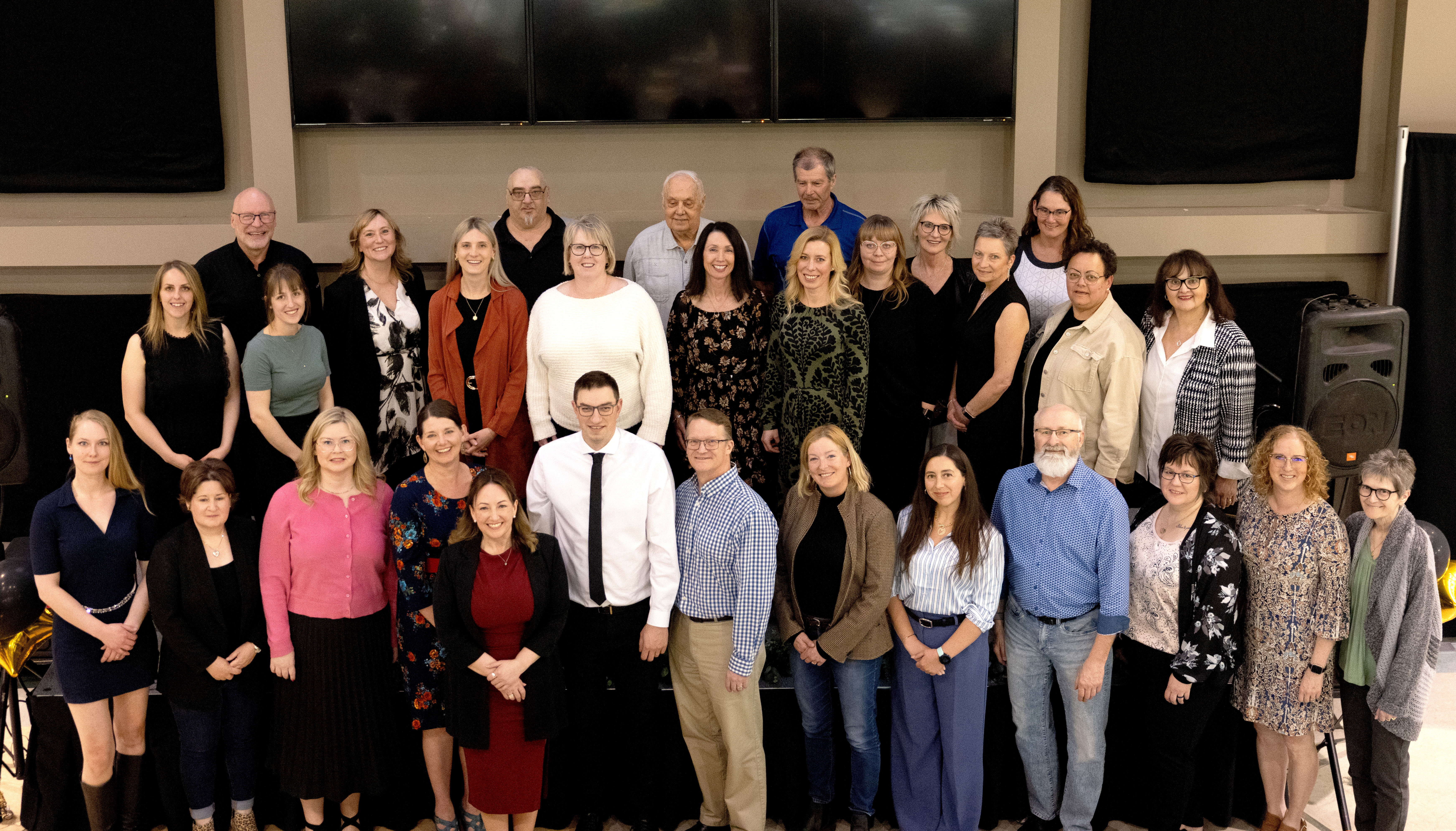 MHC employees celebrate long service awards at 2024 recognition event.