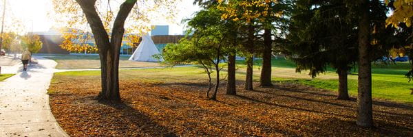 Medicine Hat campus grounds with tipi in the background