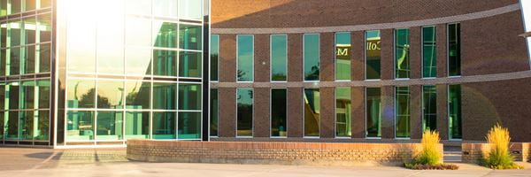 Exterior of Centennial Hall with reflection in the windows