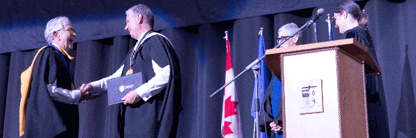 Robert Wanner is presented with Honorary Applied Degree at 2023 Convocation Ceremony.