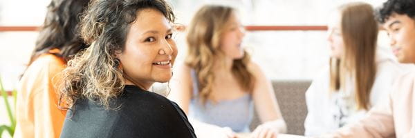 Five students studying together