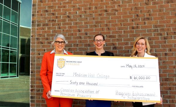 Left to Right - Nancy Brown (MHC VP Academic), Elmien Wingert (Canadian Association of Petroleum Producers, Chief Financial Officer), and Morgan Blair (MHC, Dean, MHC School of Trades and Technology) hold a cheque for $61k for program enhancement and scholarships. 