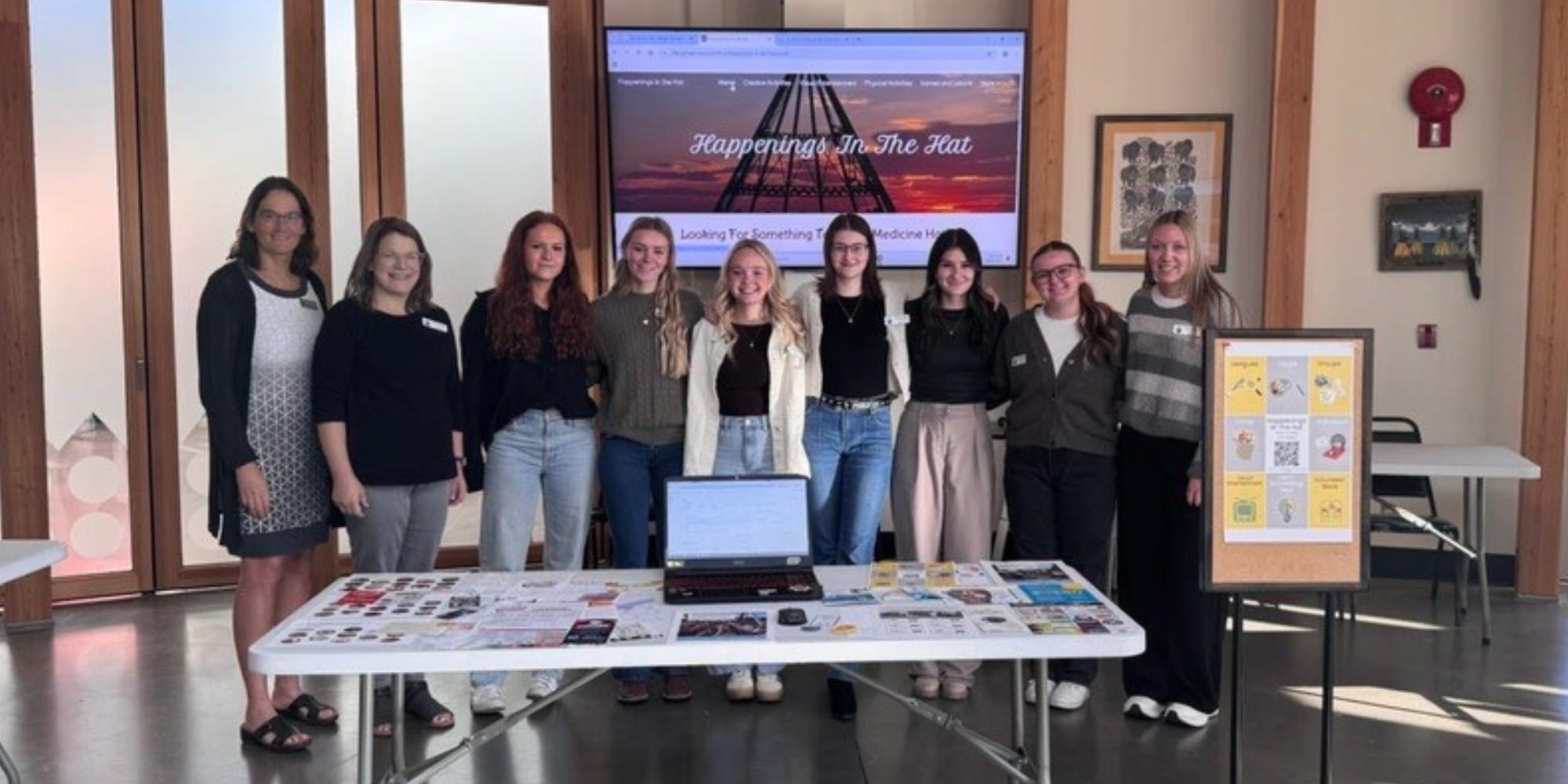 Nursing instructor and students standing and smiling at camera for the Grassroot Community Assessment. 
