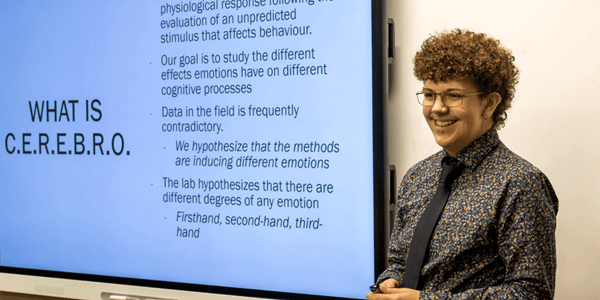 Humanities & Social Science student presenting in front of class. 