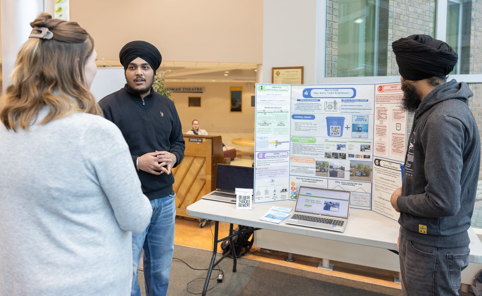 Sustainable Innovation students, presenting their poster presentation.