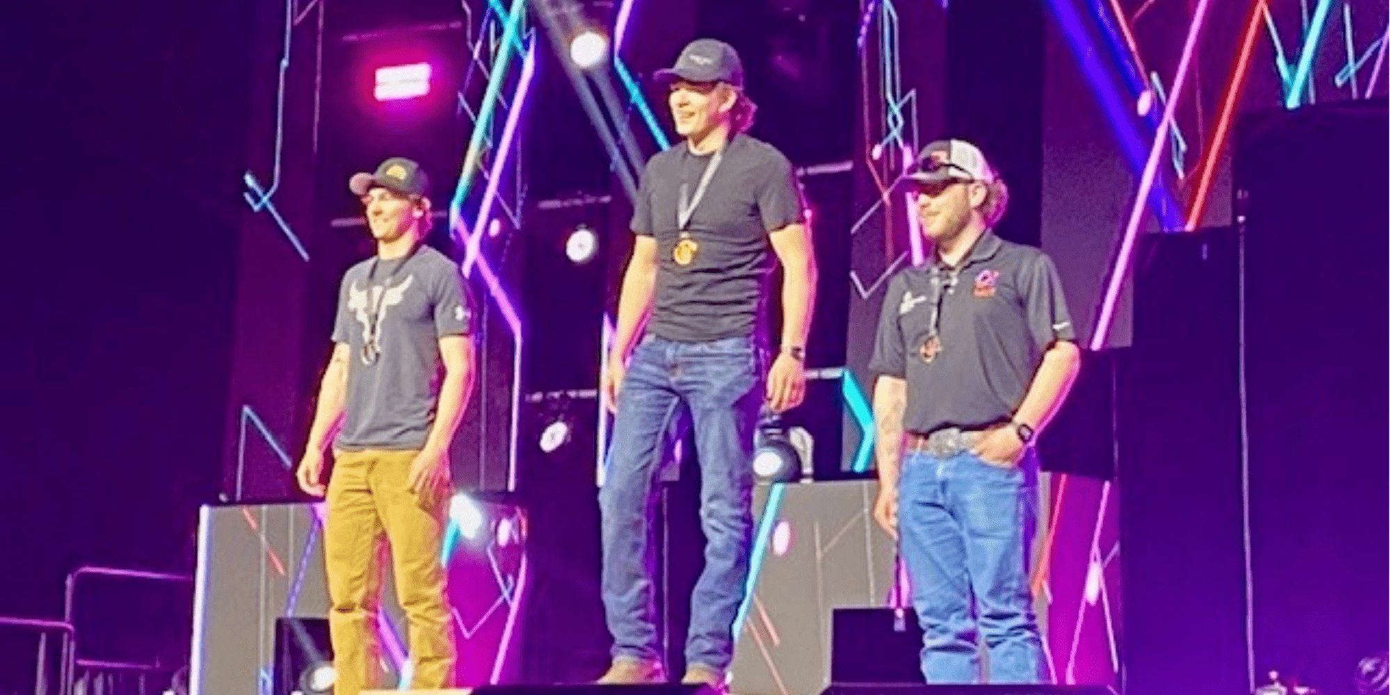 Colter Kallenberger winning bronze and standing on podium at Skills Alberta.