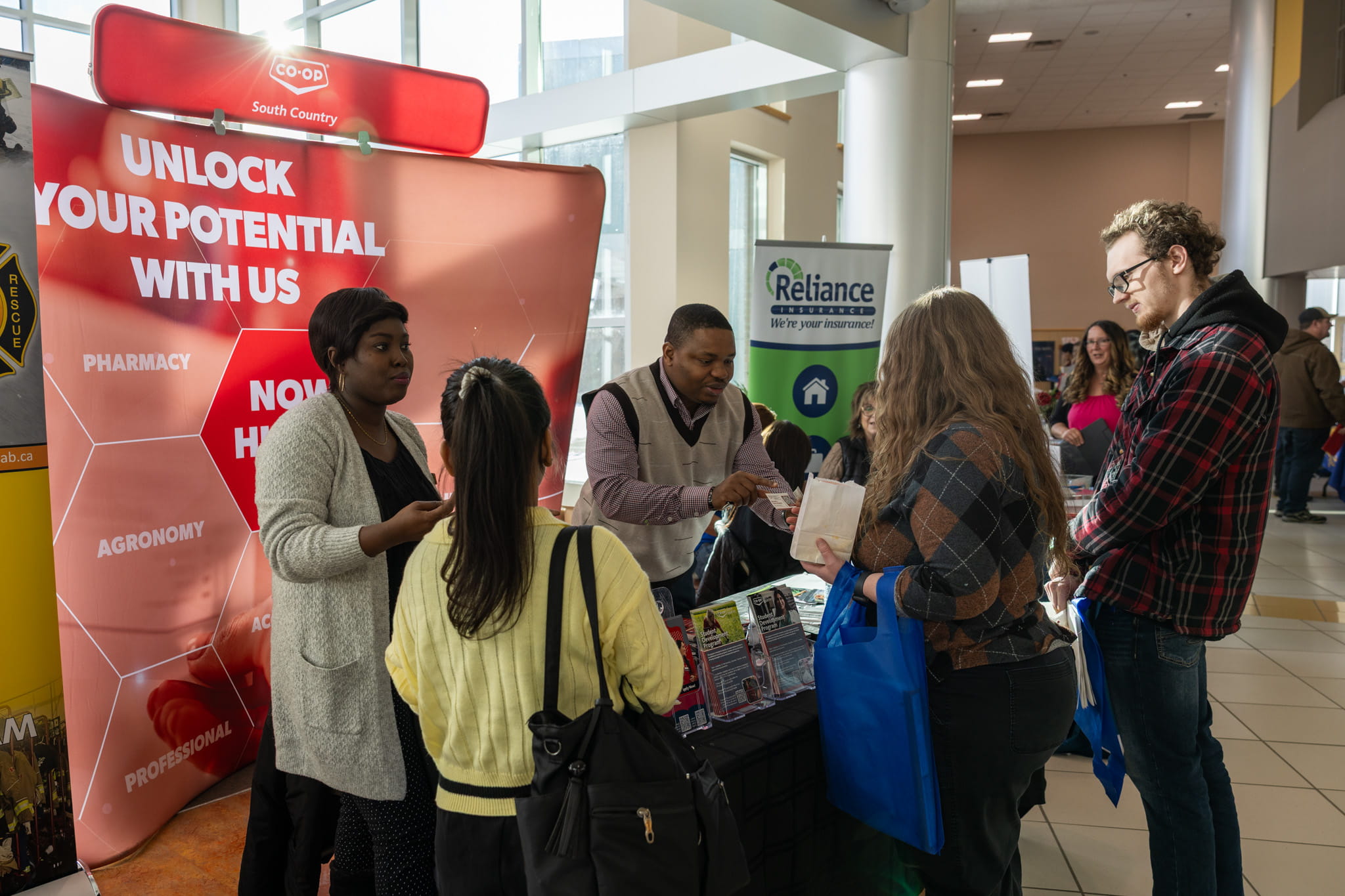 South Country Co-op chats with job seekers at their booth at Career Expo 2025.