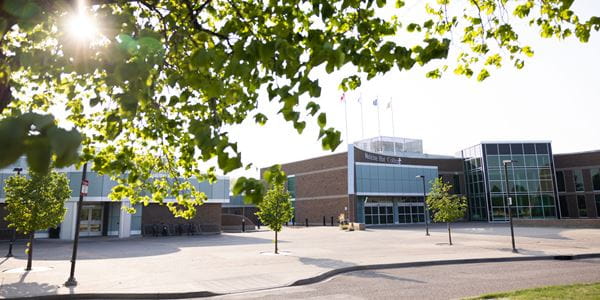 View of MH campus front entrance in summer