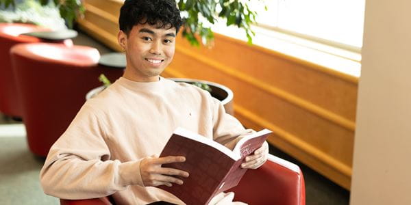 Student studying in the Vera Bracken Library
