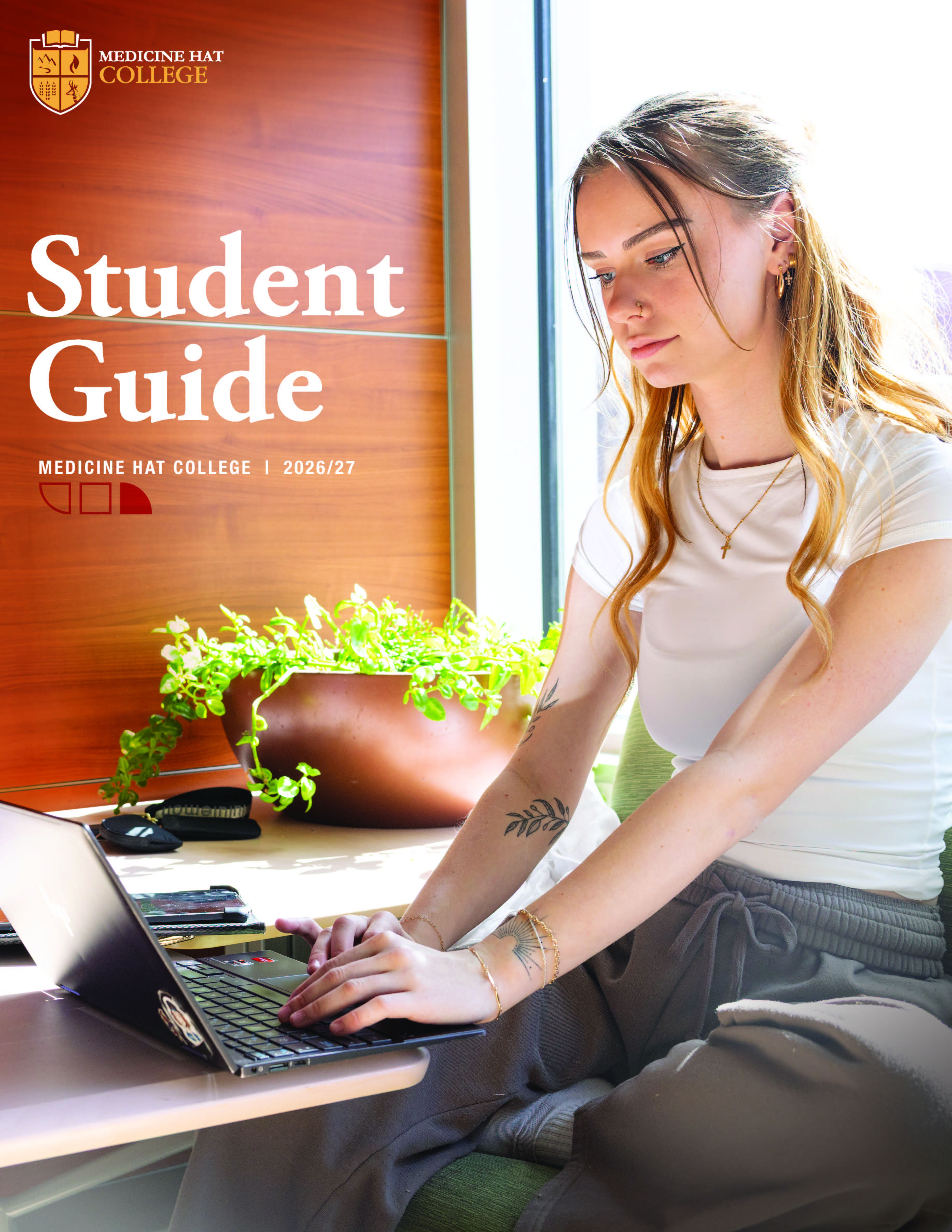 MHC Student Guide, two students working on a laptop