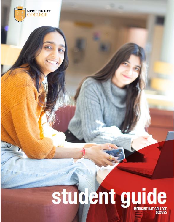 MHC Student Guide, two students working on a laptop